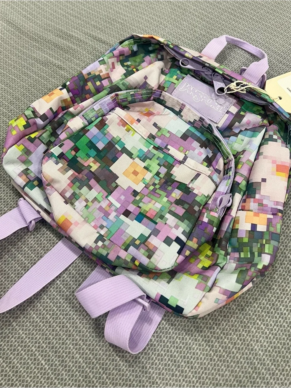 Jansport Pixel Print Mini Backpack in Lavender and Multi
